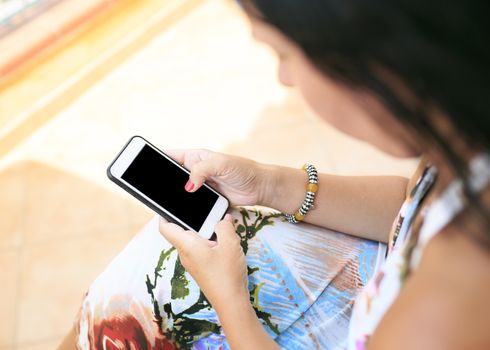 woman looking her smart  phone