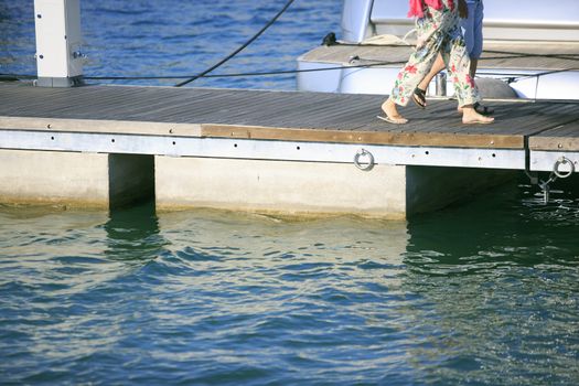 Couple walking on the port pier