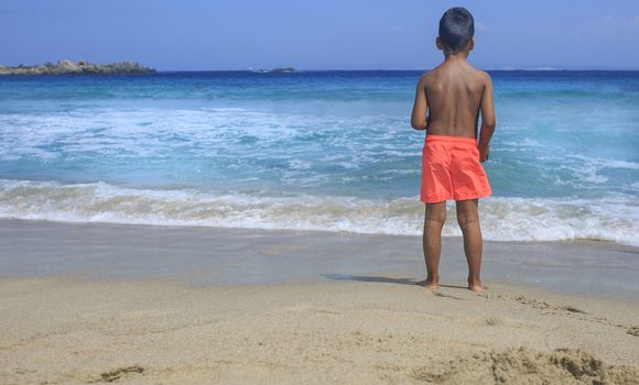 Young boy seeing the sea