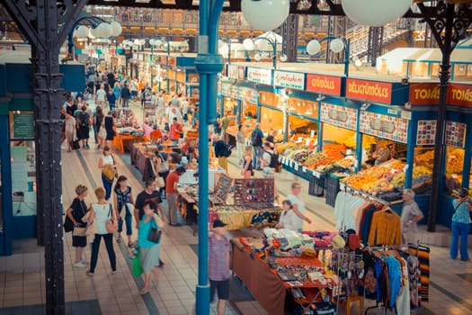 Budapest, Hungary - September 15, 2015: People shopping in the Central Market Hall in Budapest. The Central Market Hall is the largest indoor market in Budapest, it was built in 1896.
