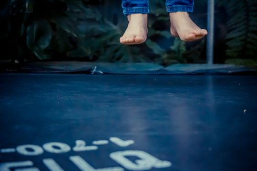 Legs floating in the air after jumping on the trampoline.
