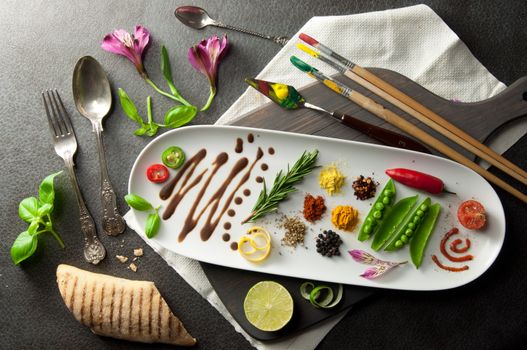 Fresh cooking ingredients including herb and spices with painters tools