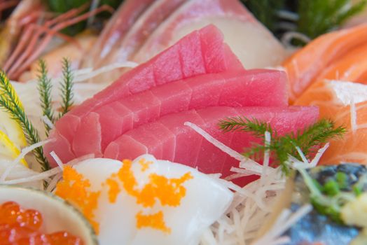 Salmon raw sashimi sushi with shrimp on plate, japanese food.