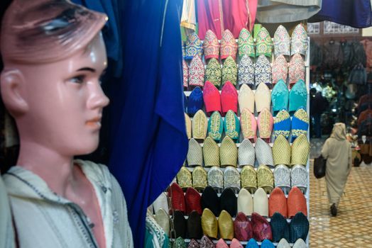 Leather shoes on traditional Moroccan market (souk) in Fez, Morocco