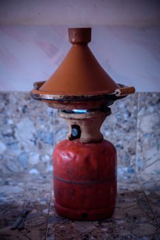 Traditional moroccan tajine making on gas bottle in the village