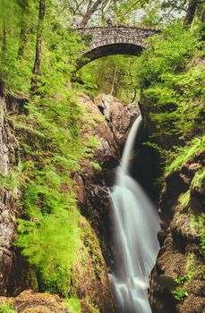 famous Aira Force waterfall on Aira Beck river in Lake District Cumbria in UK