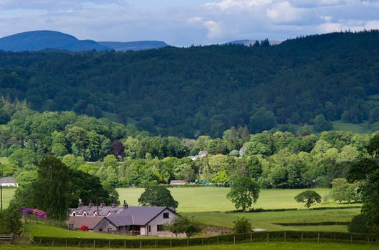 Scenic view of mountainous landscape of Lake District National park with Blea Tarn house in foreground, Cumbria, England