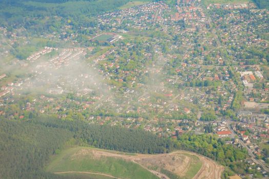 Aerial view over the small town and green area in Germany.