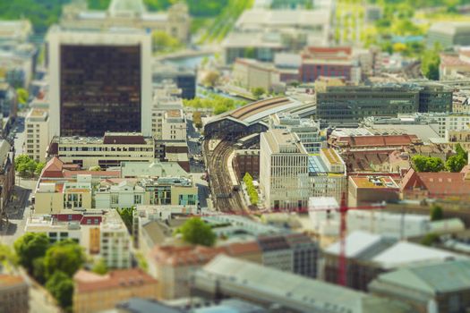 Aerial view of Berlin skyline with S-Bahn tracks rapid train and colorful buildings. with tilt-shift effect.