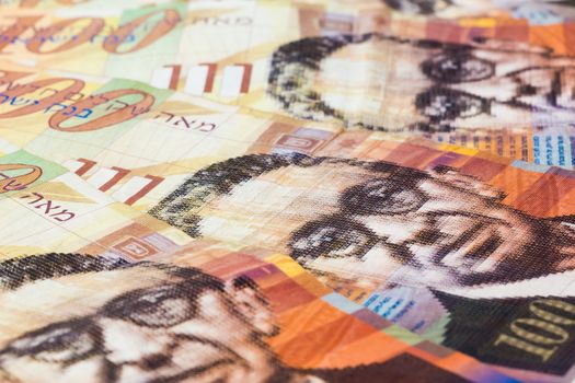 Stack of Israeli money bills of 100 shekel.