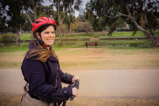 Woman riding on a Segway in the park.