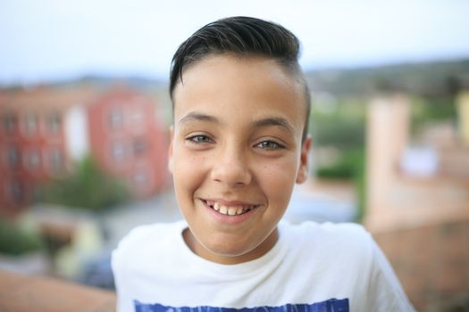 Boy with beautiful green eyes smiling