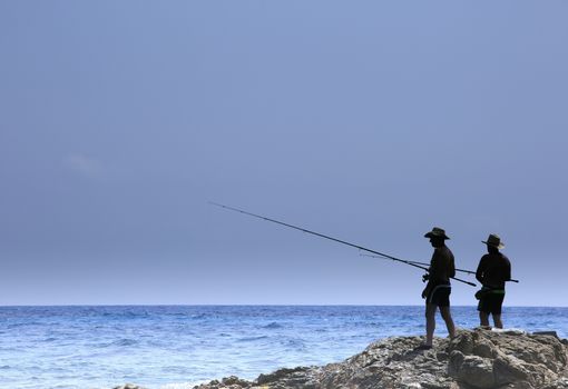 fisherman fishing on the coast of Sardinia