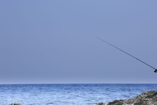 fisherman fishing on the coast of Sardinia