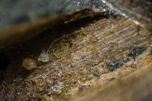 Metal key surface under the microscope. Closeup macro photography.