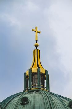 Berlin Cathedral. Close up of the cross on the top of the roof