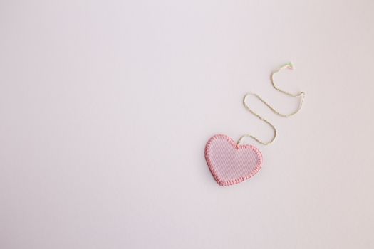 Heart-shaped cloth patch on white background.