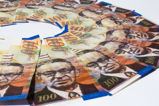 Stack of Israeli money bills of 100 shekel.