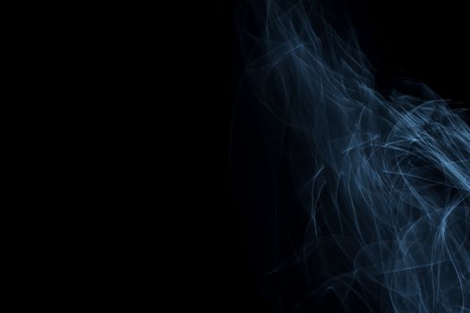 Light painted glowing abstract light blue and white curved lines on a black background
