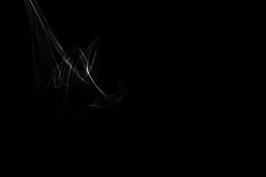 Light painted glowing abstract black and white curved lines on a black background