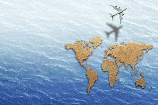 The world atlas made from sand on sea background with flying aircraft 