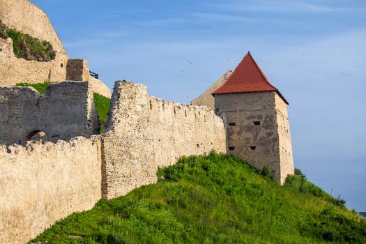 Rupea, Romania - June 23, 2013: Old medieval fortress on top of the hill, Rupea village located in Transylvania, Romania