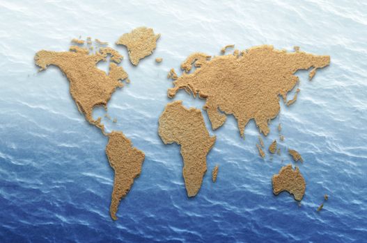 World atlas made from sand on sea background 