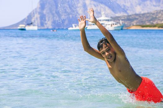 Boy swimming on the beach