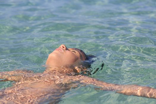 Boy swimming on the beach