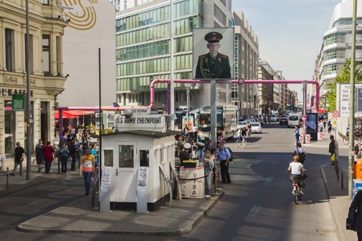 Berlin, Germany - May 17, 2017: Tourists at Checkpoint Charlie. former Berlin Wall border crossing point between East and West Berlin during the Cold War.
