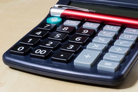 Bills, documents and papers with calculator. Office of the accounting office. Wooden table.