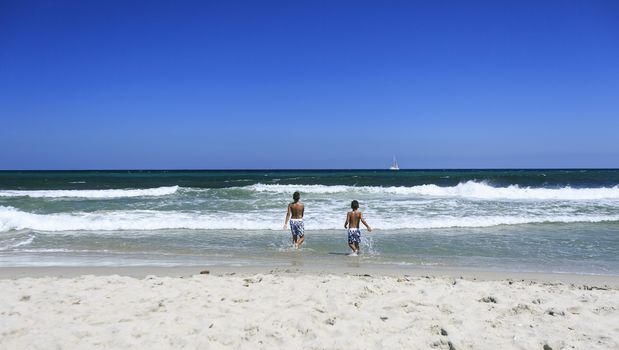 Boys playing on the beach