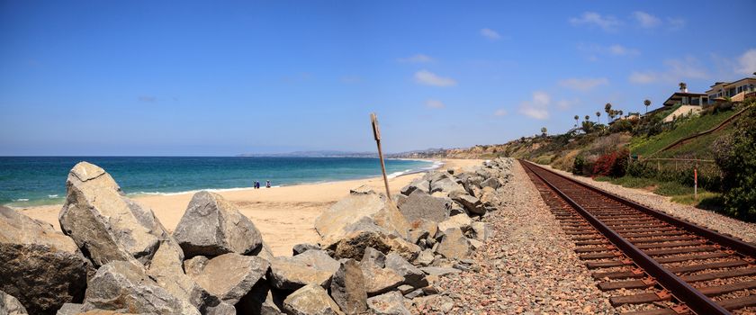 Train tracks run through San Clemente State Beach in Southern California in summer.