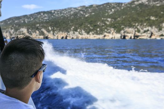 Boy in a deck of a cruise