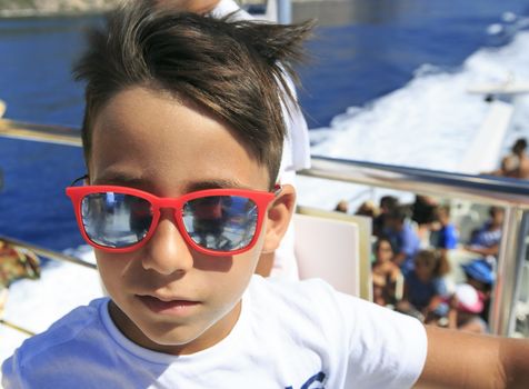 Boy in a deck of a cruise
