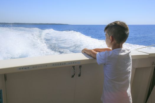 Boy in a deck of a cruise