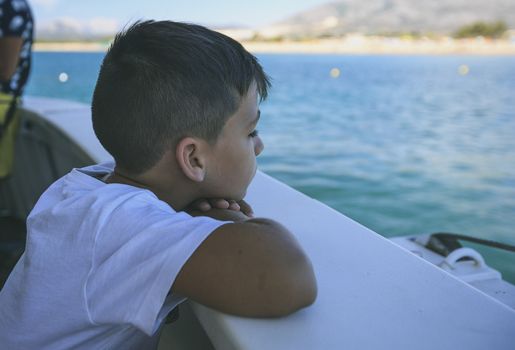 Boy in a deck of a cruise