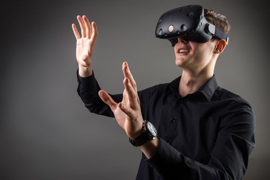 Male business executive using virtual reality headset