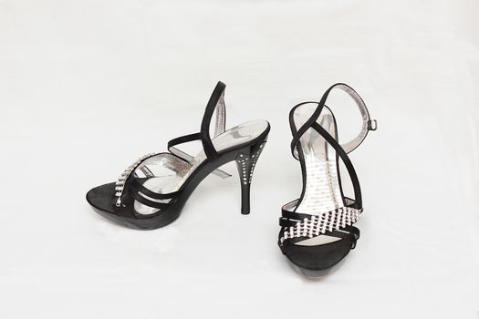 Women's shoes sandals in heels black color isolated white background.