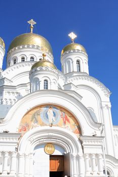 Closeup of ancient Russian Cathedral in Diveevo city against blue sky