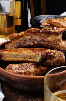 Fried spicy, sharp pork ribs with beer and ketchup. Vertical shot.