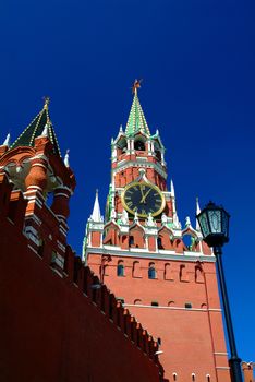 View on Moscow Red Square Kremlin tower Spasskaya Bashnya with Chiming Kuranti Clock. Moscow Kremlin Red Square best famous sightseeing places for tourist holidays vacations tours. Famous monuments