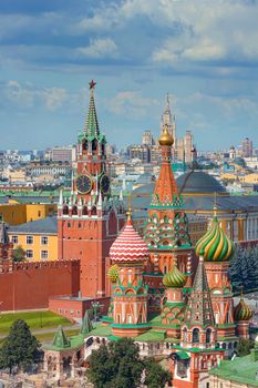 View on Moscow Red Square, Kremlin towers, stars and Clock Kuranti, Saint Basil's Cathedral church. Panorama from hotel Russia. Moscow holidays vacation tours famous sightseeing tours travel
