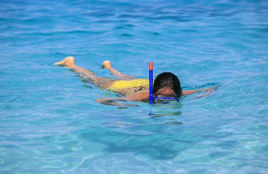 woman snorkeling on the beach