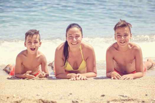 Family swimming on the beach