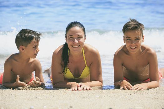 Family swimming on the beach