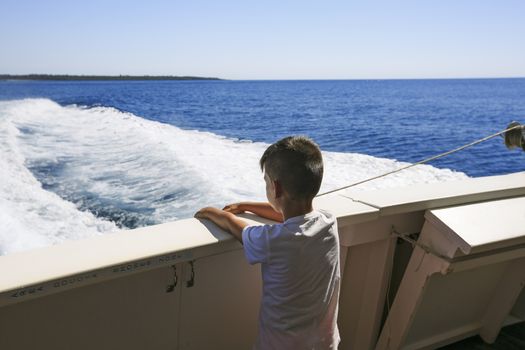 boy seeing the sea on a boat