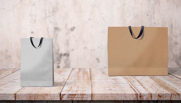 Two paper bags for shopping on a wooden background