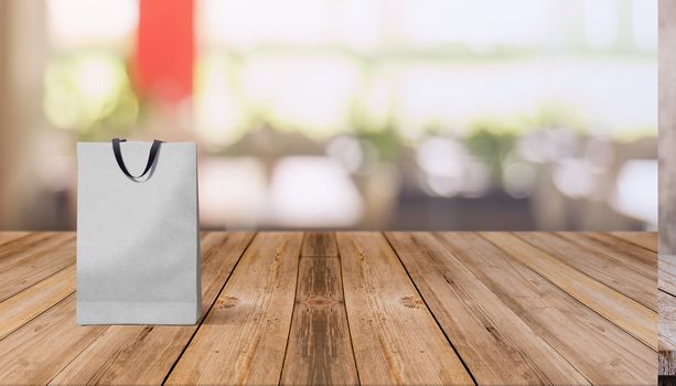 paper bag for shopping on a wooden background