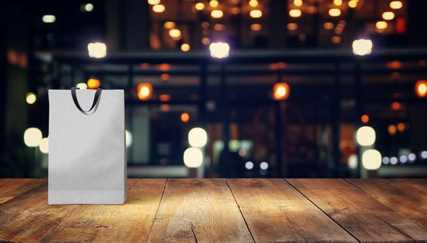 paper bag for shopping on a wooden background